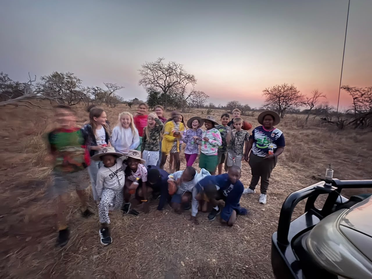 Grade 6 pupils and their guide at sunset on the Mapunga bush camp game drive